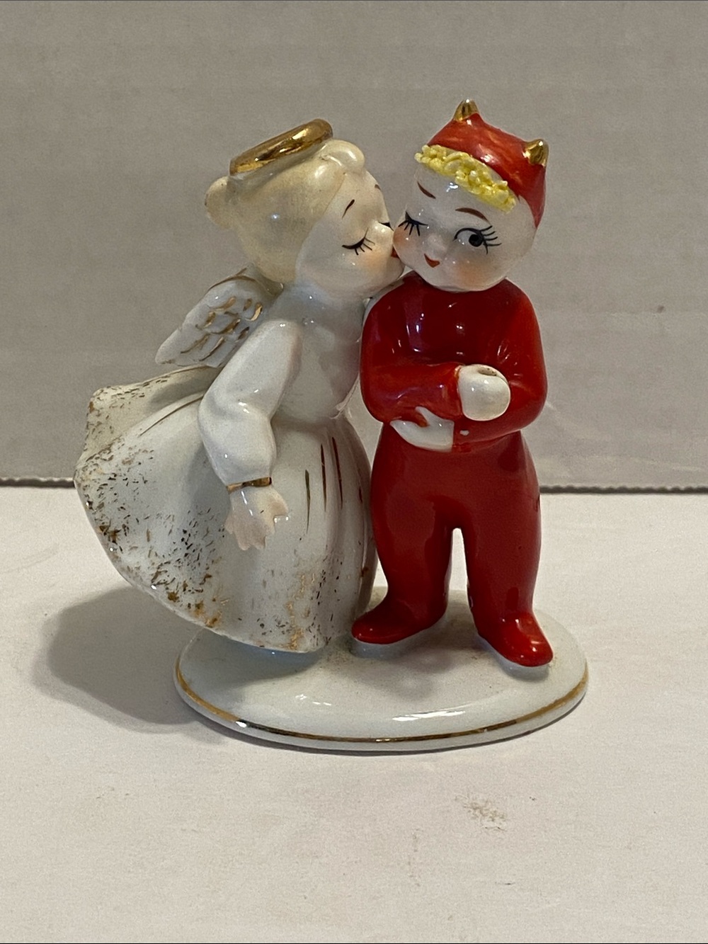vintage 1950s porcelain figurine made by Lefton, kissing angel and devil 3”